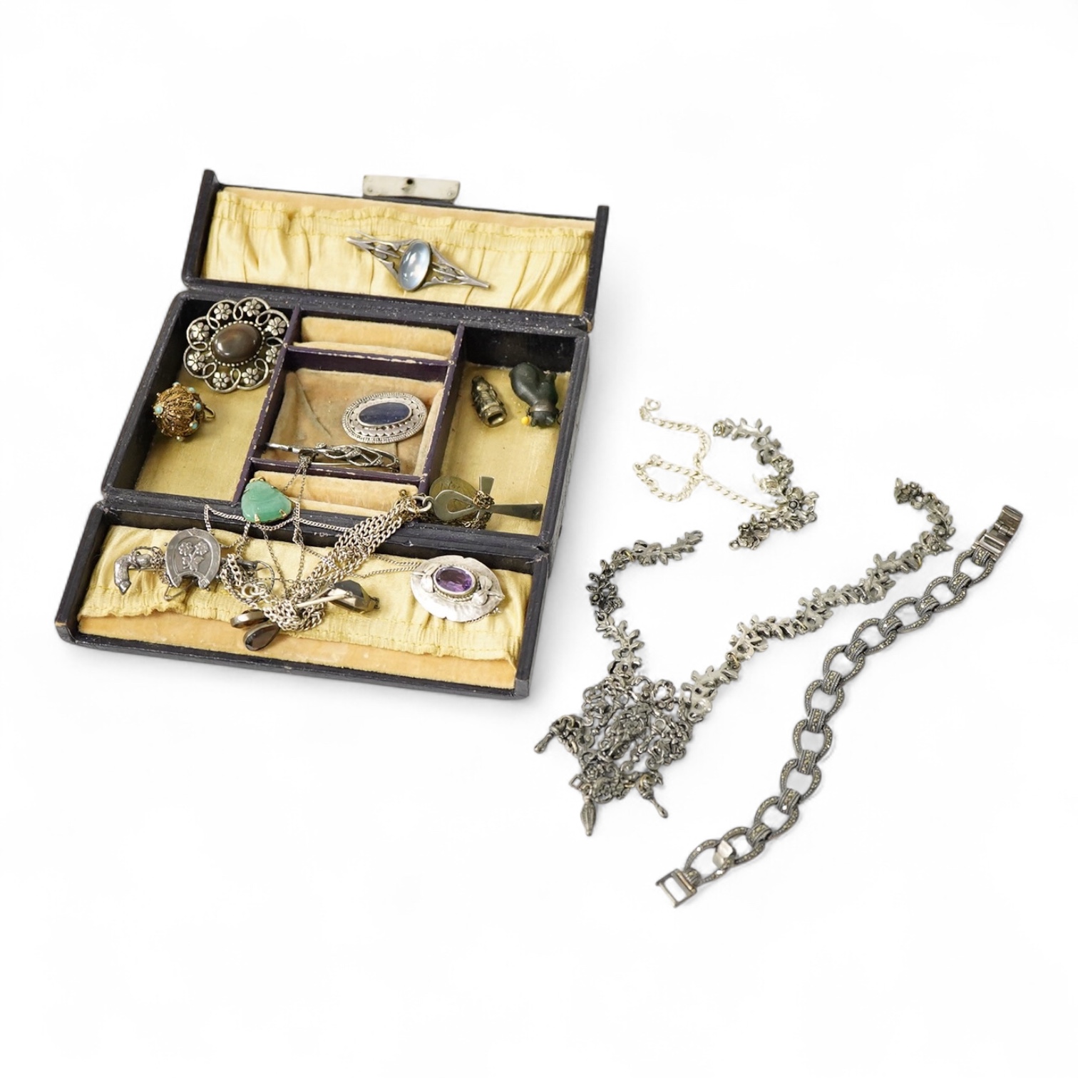 A group of mainly silver and white metal costume jewellery, including a moonstone set brooch, 53mm, a filigree gilt metal and enamel fob and marcasite set bracelet etc.
